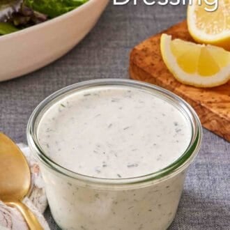 Pinterest graphic showing a small jar of ranch with sliced lemons in the background.
