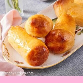 Pinterest graphic showing rum babas on a platter.