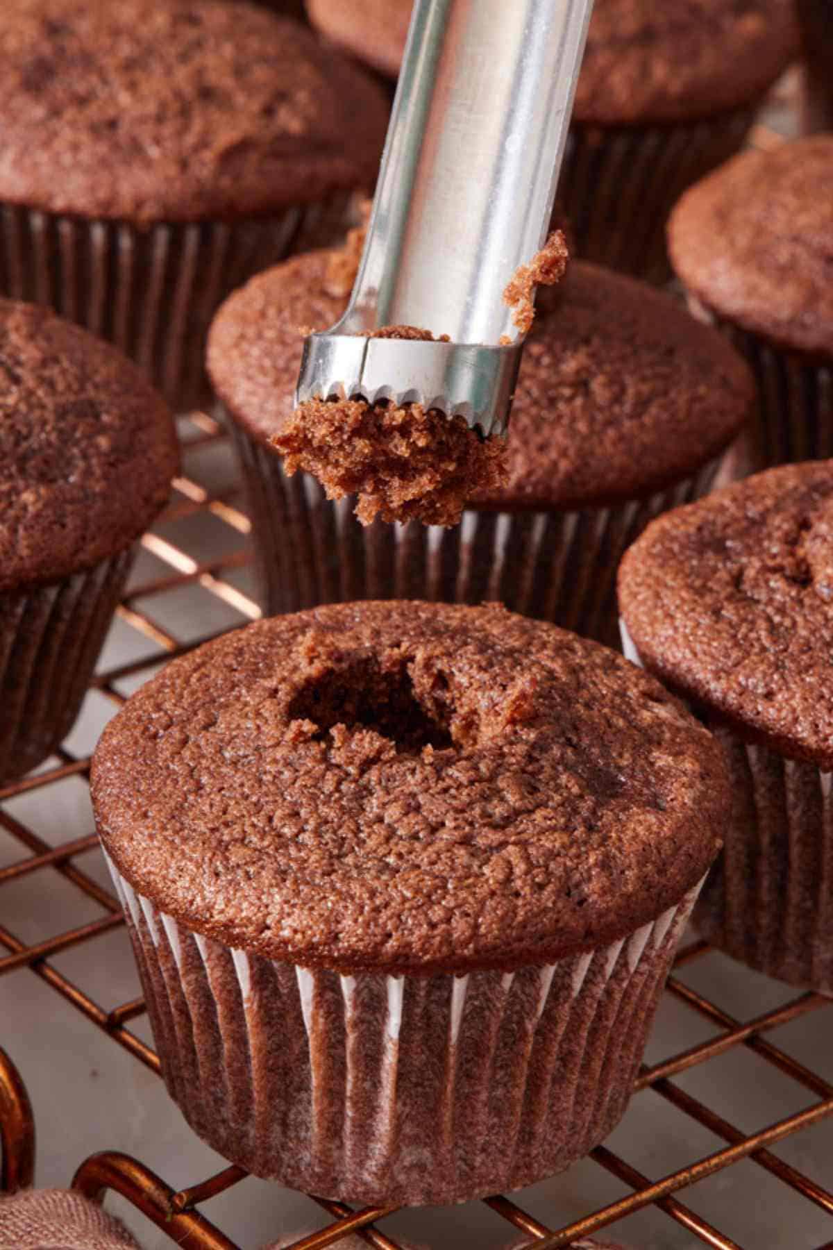 Image showing how the center of a cupcake is removed so it can be filled.
