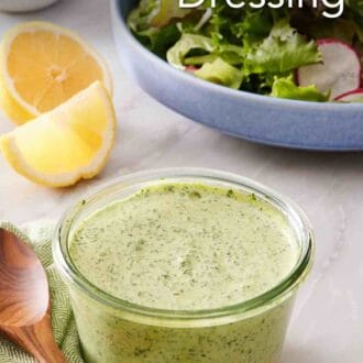 Pinterest graphic showing a small glass jar of green goddess salad dressing.