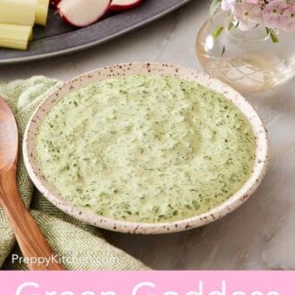 Pinterest graphic showing a bowl of green goddess salad dressing beside a small vase of flowers.