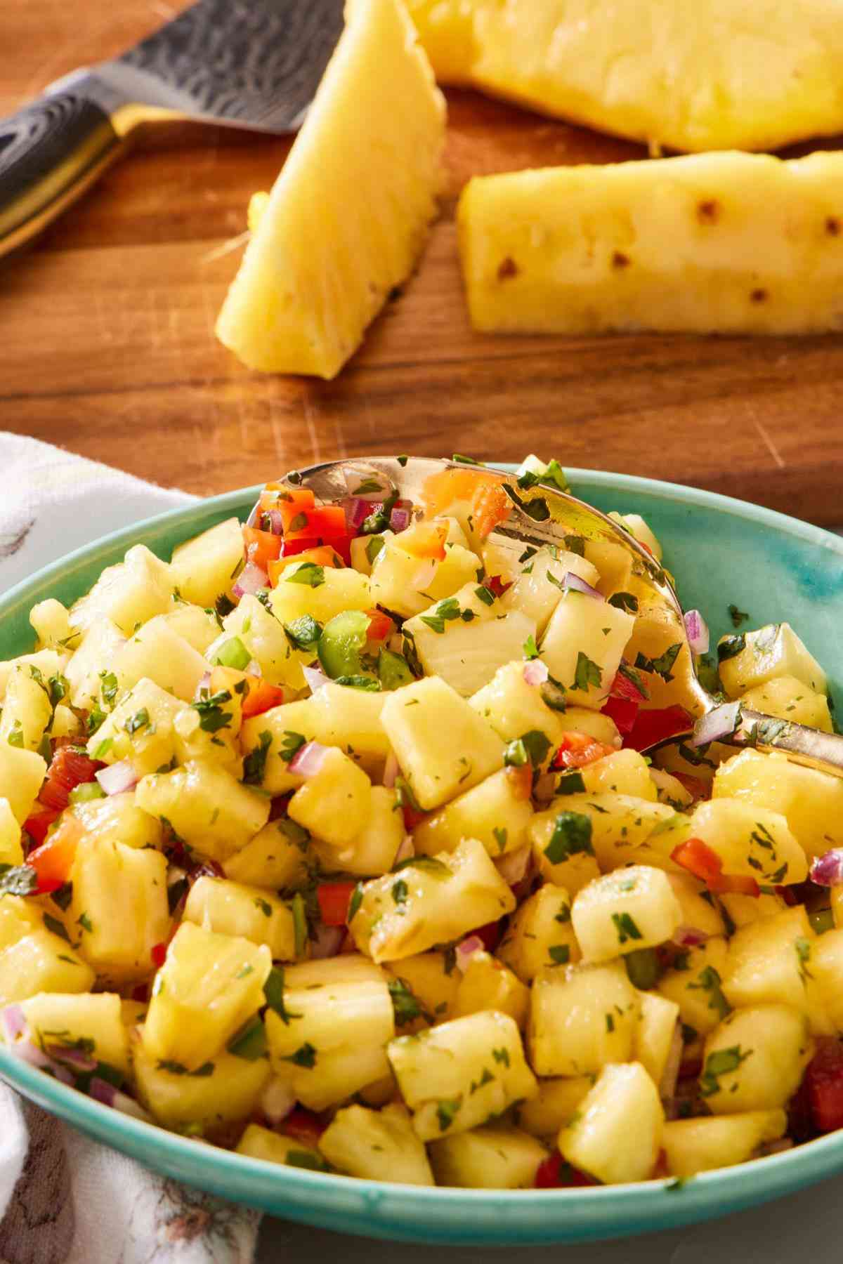 Pineapple salsa with diced pineapple prepared using this how to cut a pineapple tutorial.