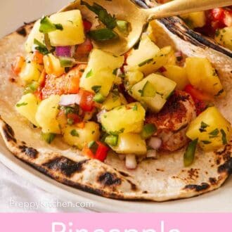 Pinterest graphic showing a close-up of a grilled tortilla with fresh pineapple salsa spooned onto it.