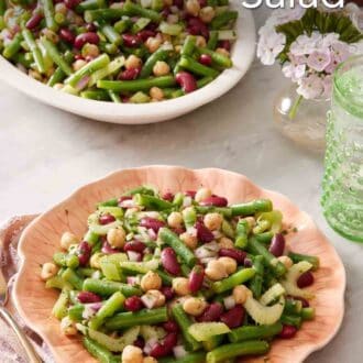 Pinterest graphic showing bean salad on a plate with more in the background on a platter.