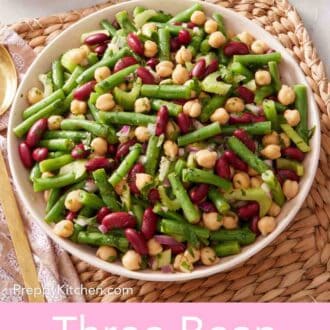 Pinterest graphic showing three bean salad in a bowl on a woven mat.