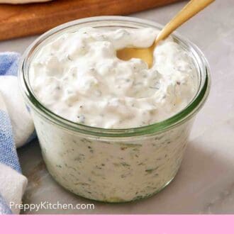 Pinterest graphic showing a glass jar of homemade tzatziki.