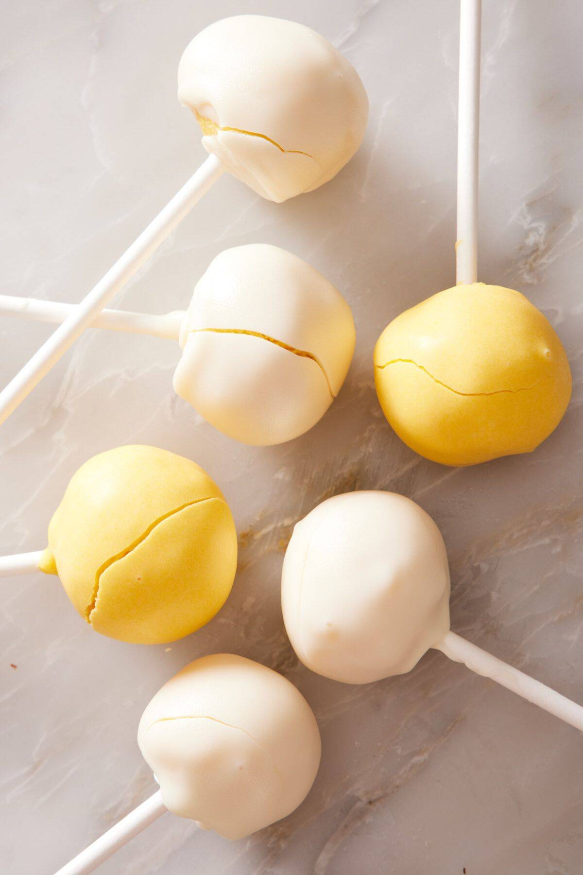 Cake pops with a cracked coating.