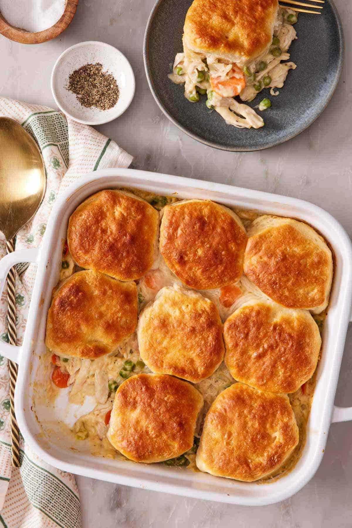 Overhead shot of chicken pot pie made in a casserole dish with a biscuit topping.