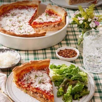 Pinterest graphic showing a slice of deep dish pizza on a plate with a side salad. A drink and the rest of the pizza are also in frame.