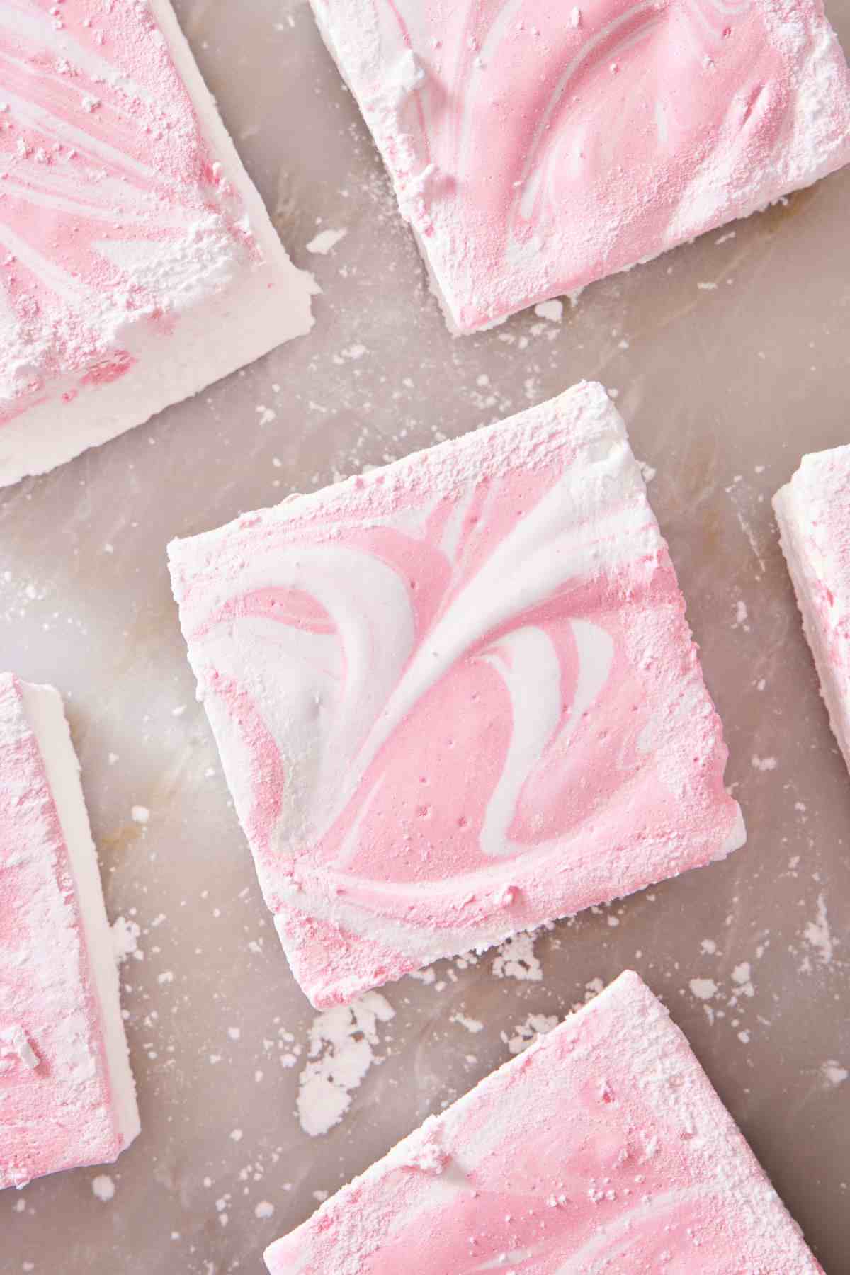 Pink and white marbled homemade marshmallows.