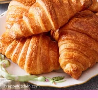 Pinterest graphic showing a pile of homemade croissants.