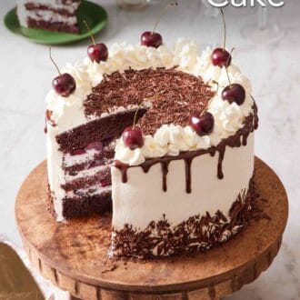 Pinterest graphic showing a black forest cake with a slice cut out and placed on a plate nearby.