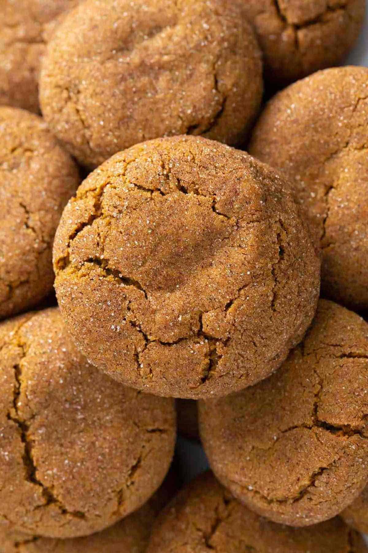 Overhead close-up shot of a pile of gingersnap cookies.