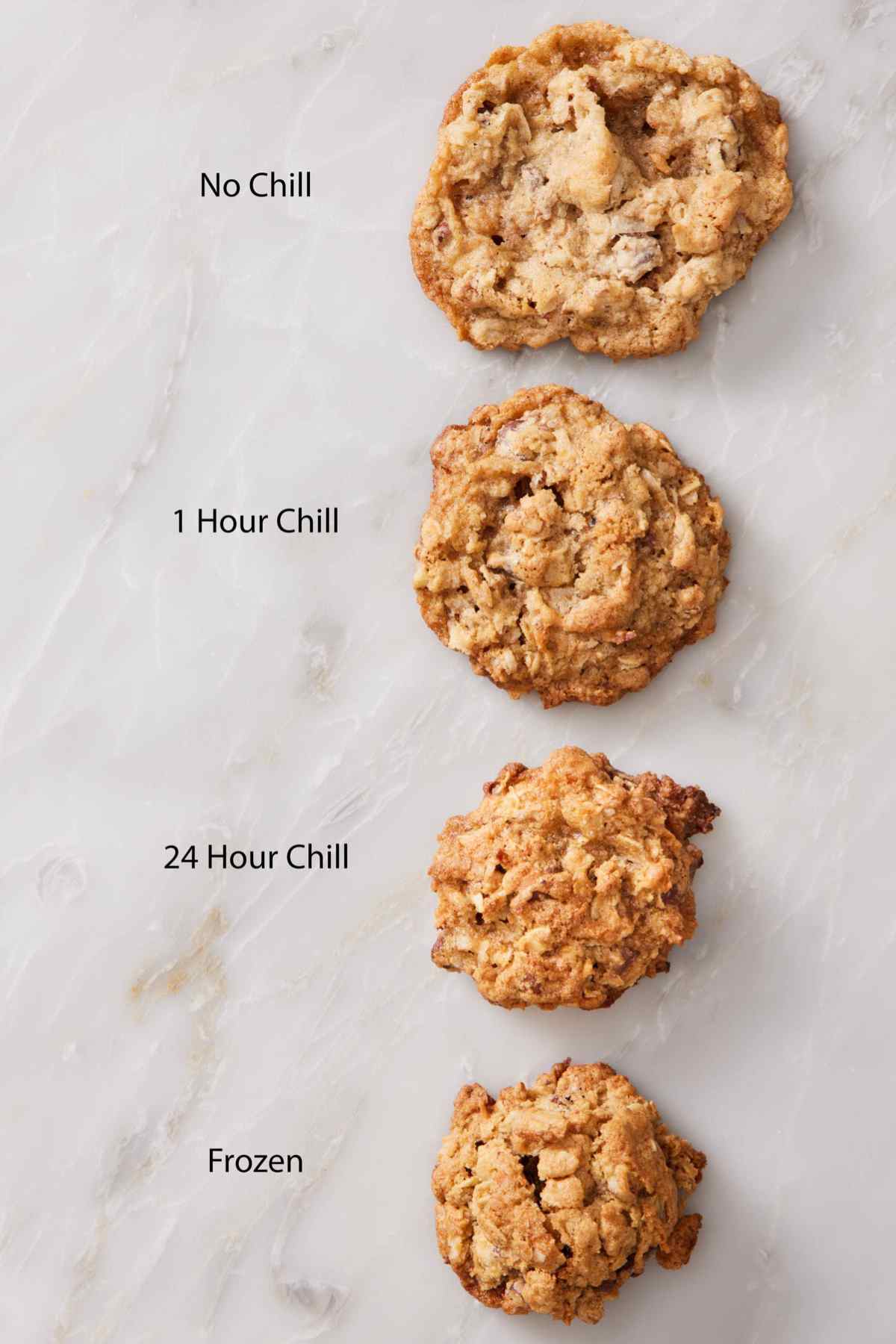 Four cowboy cookies showing how much they spread when baked with different chill times for the dough.