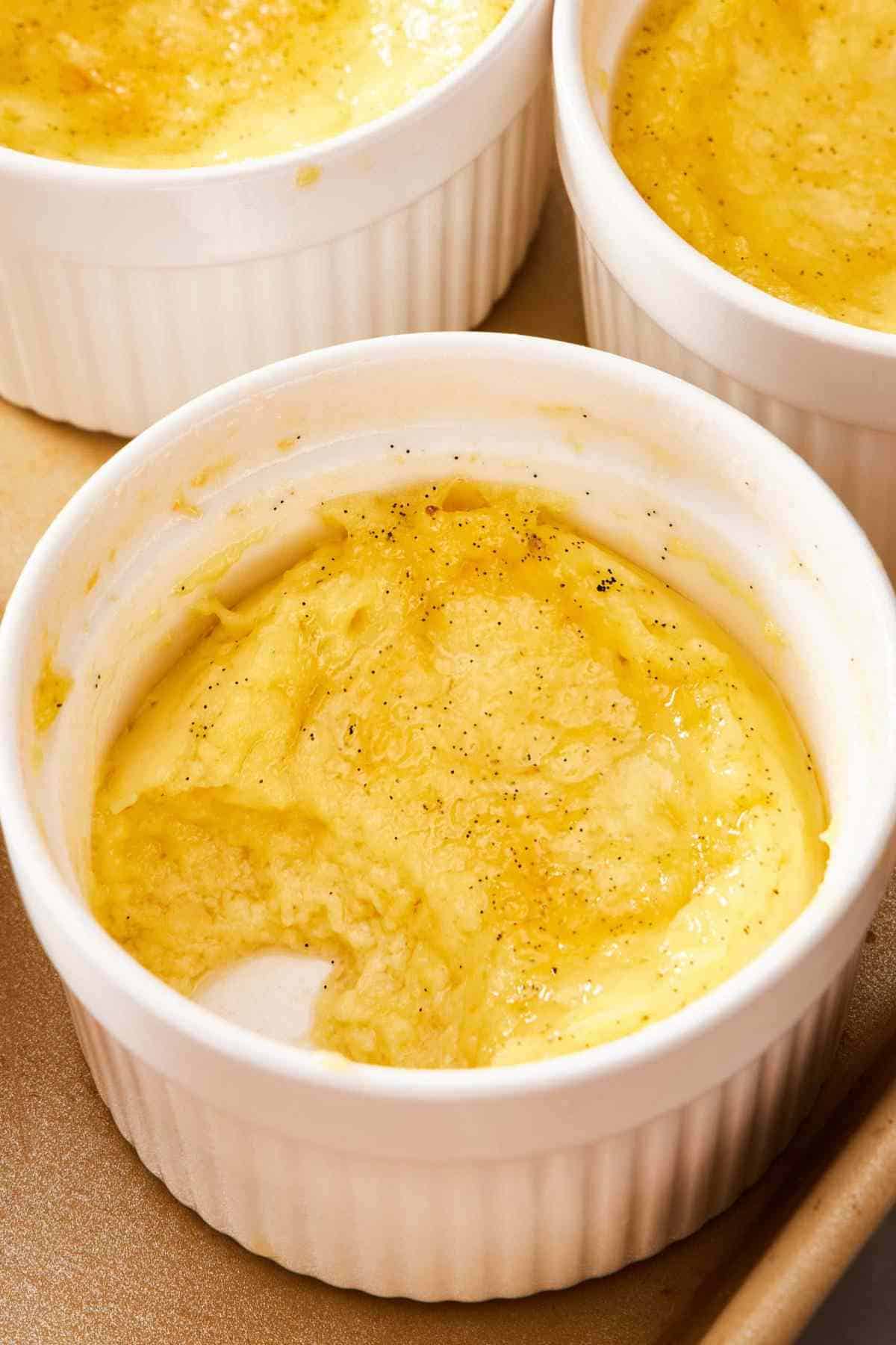 Close up of a ramekin of creme brulee curdled because it was not cooked in a water bath.