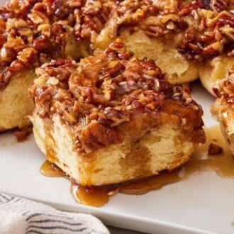 Close-up of pecan sticky buns on a serving platter.
