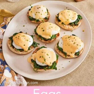 Pinterest graphic showing multiple eggs Florentine on a platter with seasonings in the background.