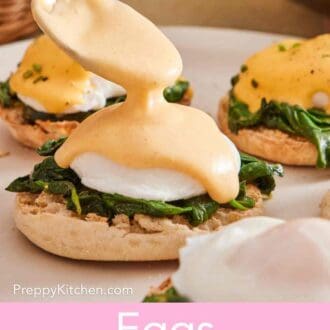 Pinterest graphic showing eggs Florentine with sauce being spooned over top.