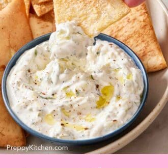 Pinterest graphic showing a pita chip dipped into and lifted out of tzatziki.