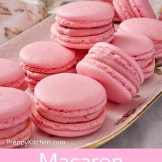 Pinterest graphic showing several pink macarons on a platter.