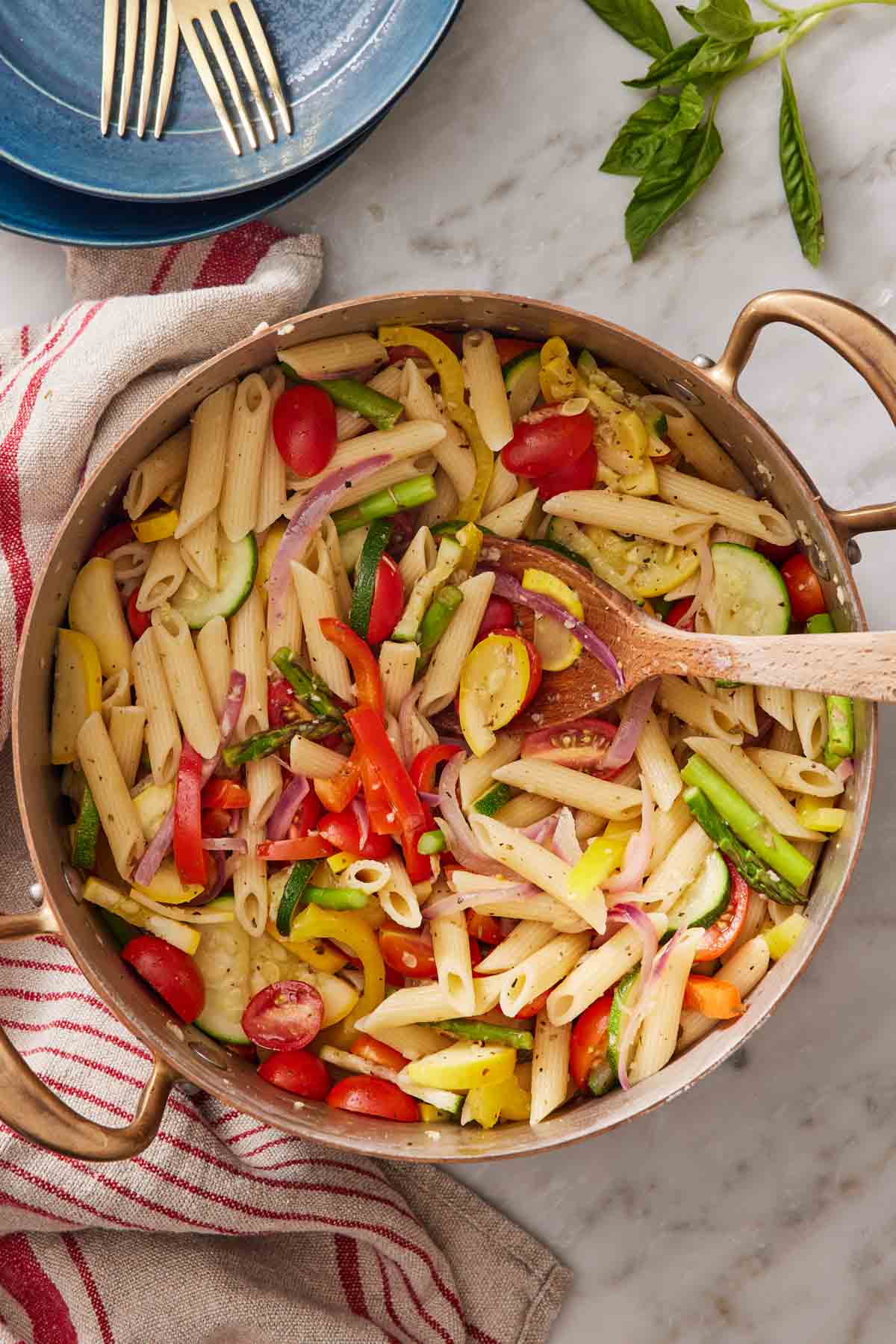 Overhead shot of pasta primavera in a large pot.