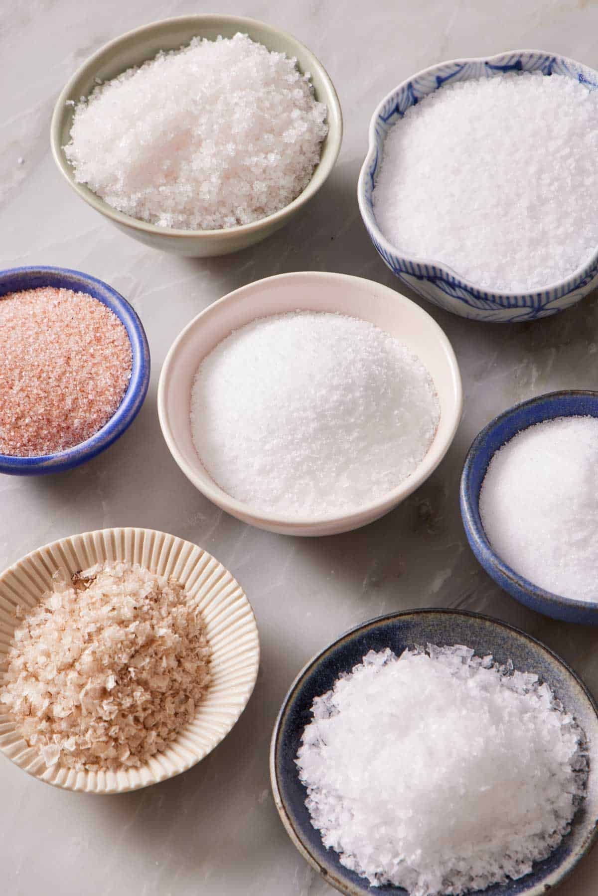 Bowls containing different types of salt.